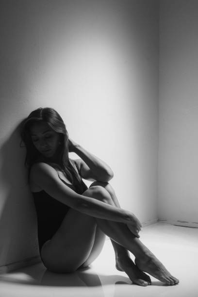 istock Young woman near wall 821614600