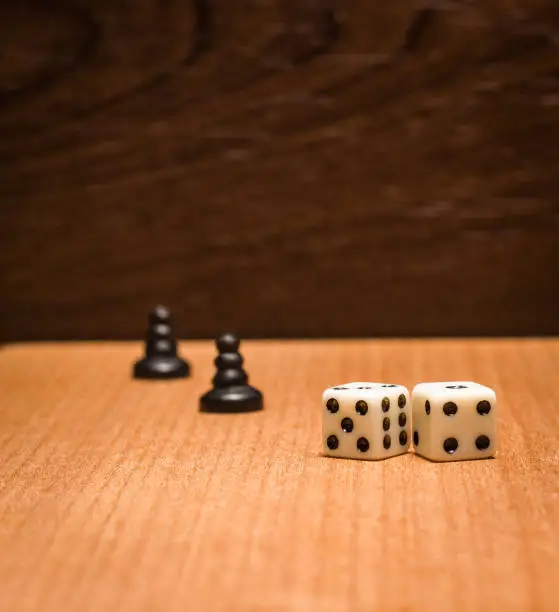 Photo of Pawns and dice for logical board games