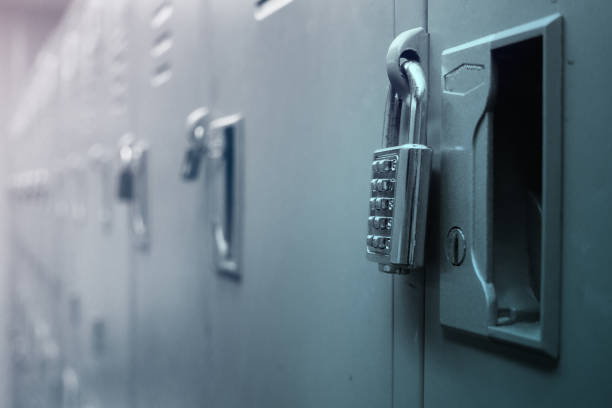 istock Closeup padlock with key number hanging on locker for concept technology data log security. 821621770