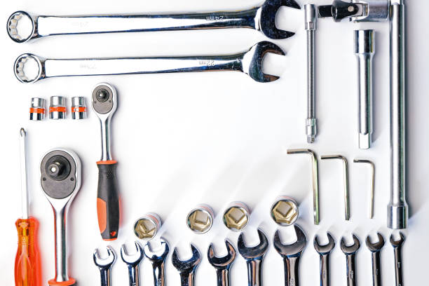 istock Top view of Working tools,wrench,socket wrench,hammer,screwdriver,plier,electric drill,tape measure,machinist square on white background. flat lay. 821624630