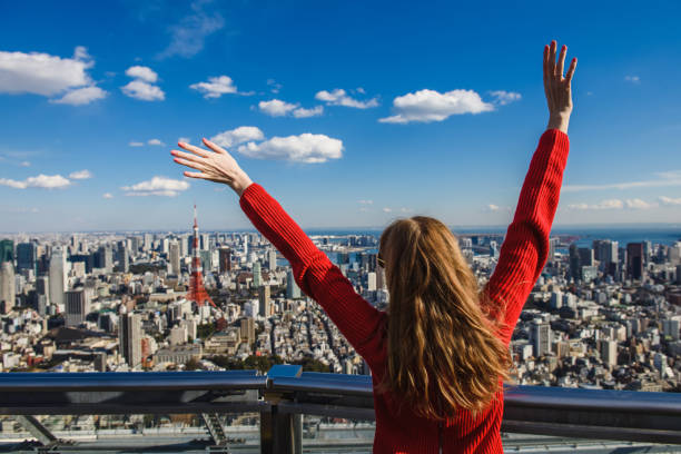 istock Happy young woman with her hands up. 821627888