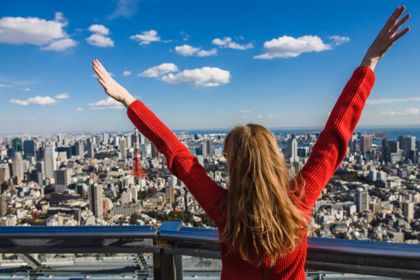 istock Happy young woman with her hands up. 821627928