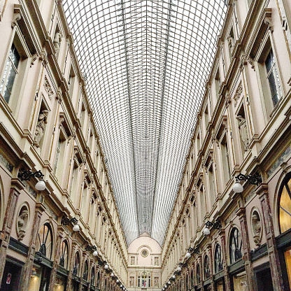 Brussels, Belgium - October 2015. Shoppers walk down Galeries Royales Saint-Hubert in Brussels.
