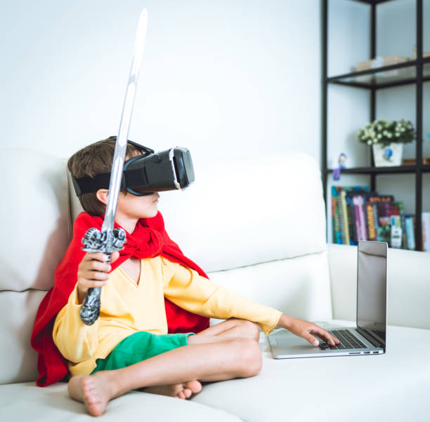 istock Young boy play the video game with Virtual Reality 821637800
