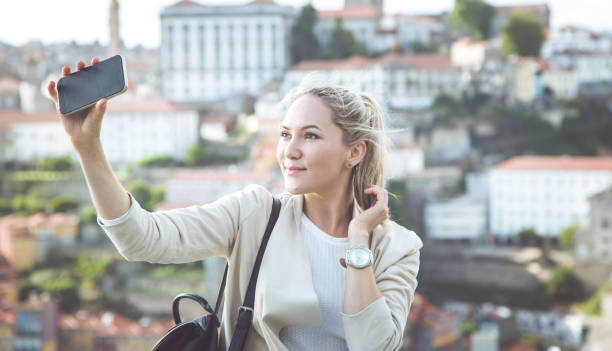istock Beautiful young woman in real life, she making selfie 821637882