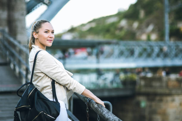 istock Young woman is watching to the river 821639958