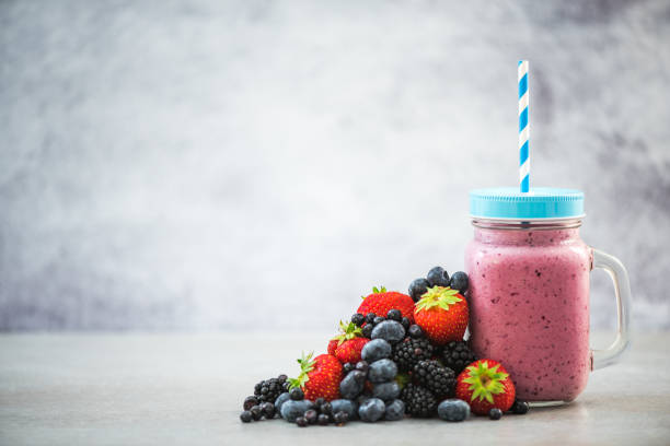 istock Ingredients for healthy berry smoothie and jar 821654986