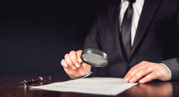 istock Businessman Reading Contract Details Before Signing 821655778