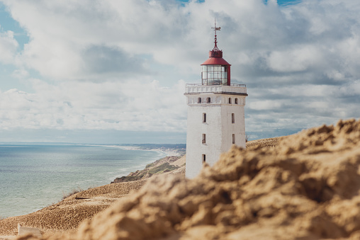 Rubjerg Knude Lighthouse, swallowed by sand. Rubjerg Knude Lighthouse (Danish: Rubjerg Knude Fyr) is located on the coast of the North Sea in Rubjerg, in the Jutland municipality of Hjørring in northern Denmark.