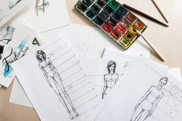 istock Designer fashion sketches on desk 821661860