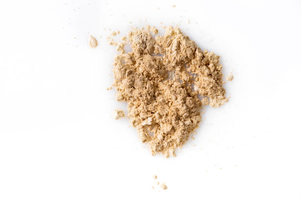 istock Beige powder for face isolated on white background 821663786