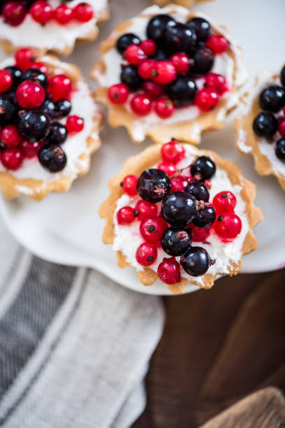 istock Homemade currant tart pie on wooden table 821669432