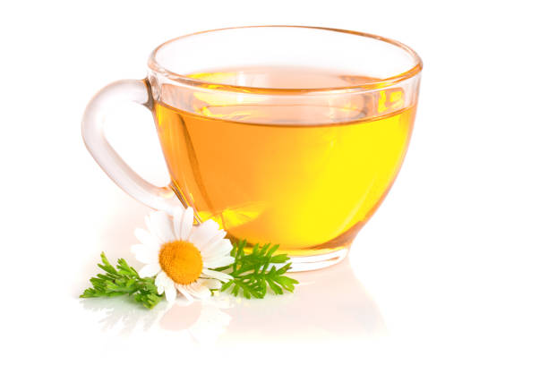 istock Herbal tea with fresh chamomile flowers isolated on white background 821691178