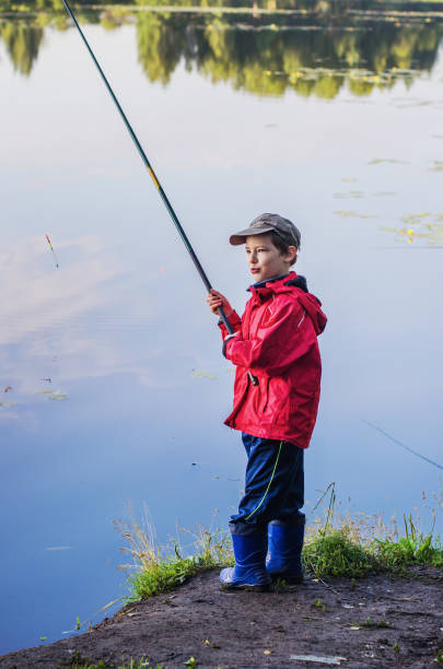 istock summer fishing on the pond 821694748