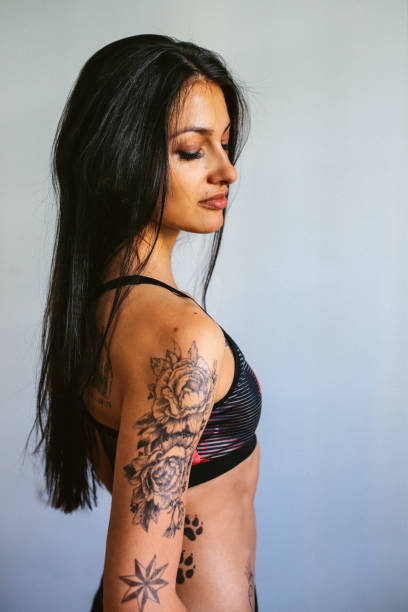 istock Young woman lifting weights on cross training 821703118