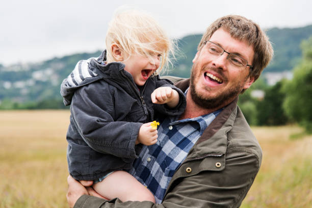 istock Family Father Son Smiling Togetherness Outdoors Carrying Concept 821715072