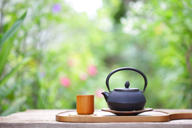 istock Black vintage teapot and cup  at outdoor 821715636