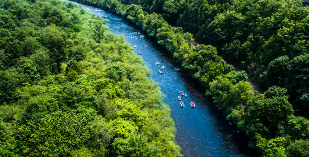 Rafting at the Lehigh River near by Jim Thorp (Mauch Chunk), Carbon County, Poconos region, Pennsylvania Rafting at the Lehigh River near by Jim Thorp (Mauch Chunk), Carbon County, Poconos region, Pennsylvania. The sunny summer day. Aerial photo. the poconos stock pictures, royalty-free photos & images