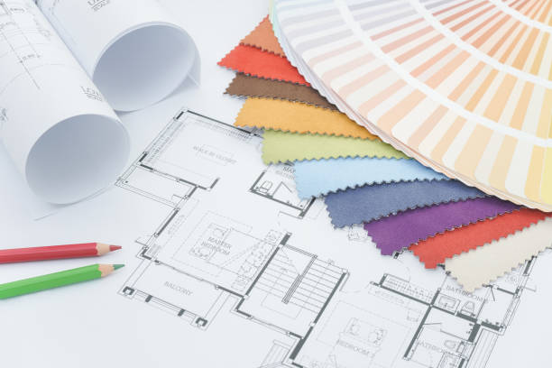 istock Interior designer working desk with drawing, fabric sample, color pencil and color palette 821716558