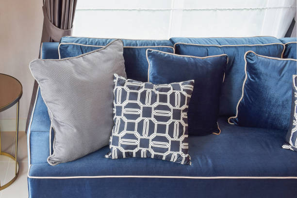 istock Navy blue classic sofa and retro pillows in living corner 821718738