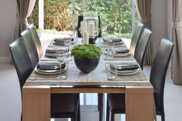 istock dining wooden table and comfortable chairs in modern home with elegant table setting 821718802