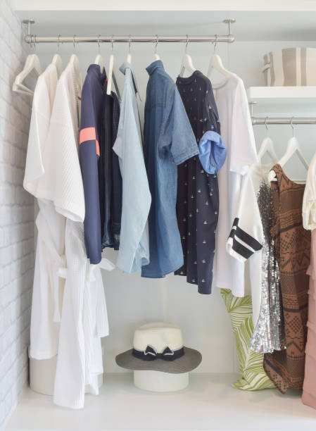istock Casual cloths hanging in open wardrobe at modern home 821719242
