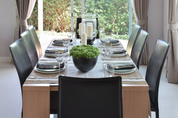 istock dining wooden table and comfortable chairs in modern home with elegant table setting 821719640