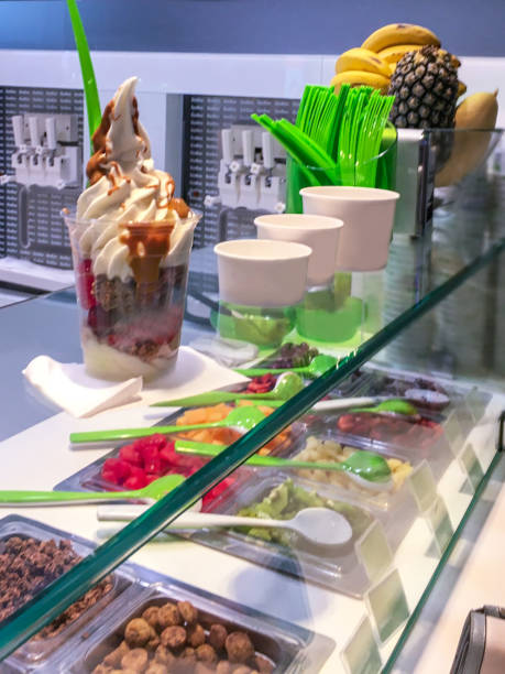 istock Frozen yogurt with chocolate sauce and berry topping 821719830