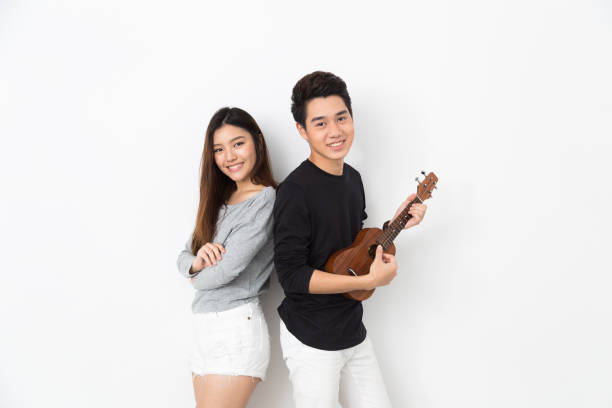 istock Young Asian Couple playing ukulele 821727858
