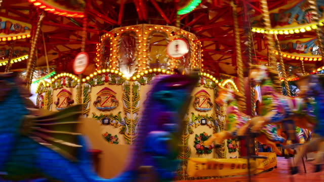 4K Abstract light Carousel, circus and Amusement park with kids, London