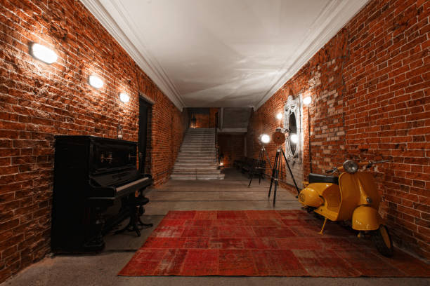 istock Modern industrial creative workspace. staircase with textured brick walls to the attic loft 821731146