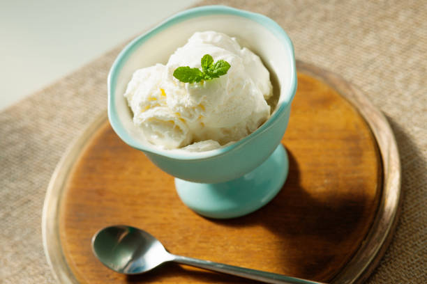 istock Ice cream in bowl and metal spoon 821737732