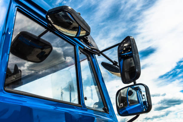 The Mirror on sky background Lots of mirrors on the cab of the truck look very picturesque against the background of the cloudy sky. car transporter stock pictures, royalty-free photos & images