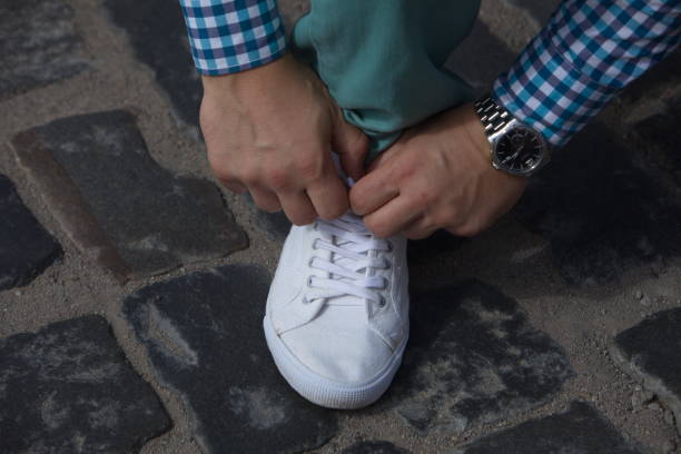 istock A man ties up his shoelaces 821742366