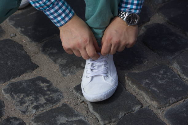 istock A man ties up his shoelaces 821742370