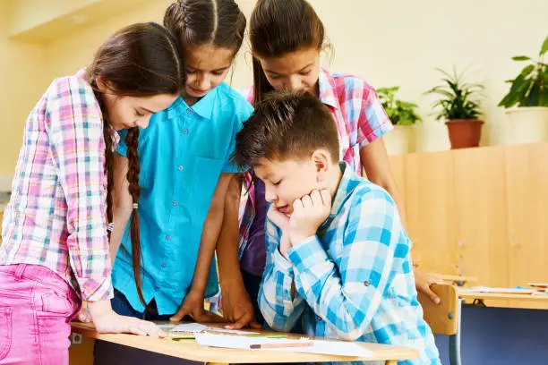 Photo of Children on Break  in Classroom