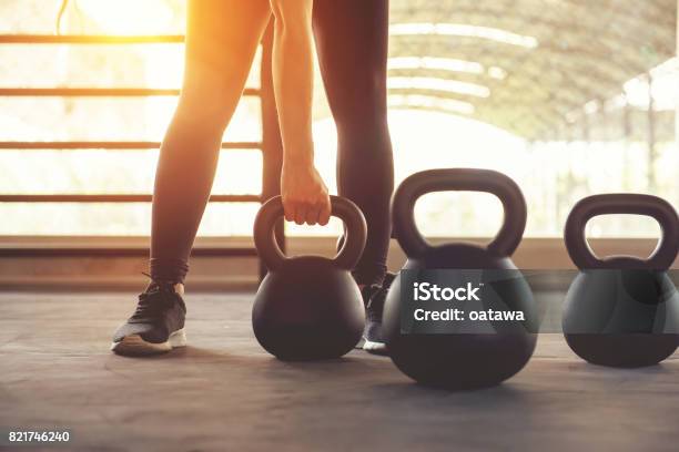 Fitness Training With Kettlebell In Sport Gym Stock Photo - Download Image Now - Kettlebell, Exercising, Gym