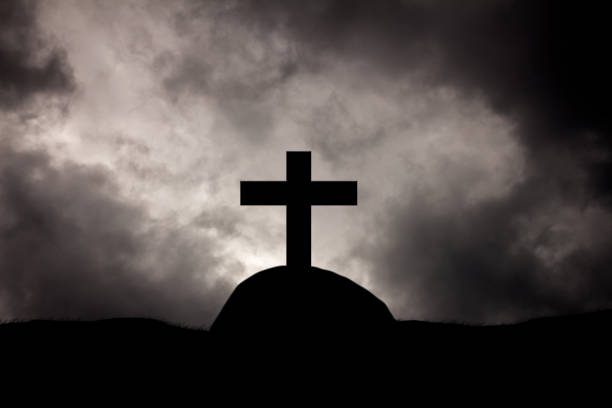 istock Rain clouds on Christian crosses graves. 821751450