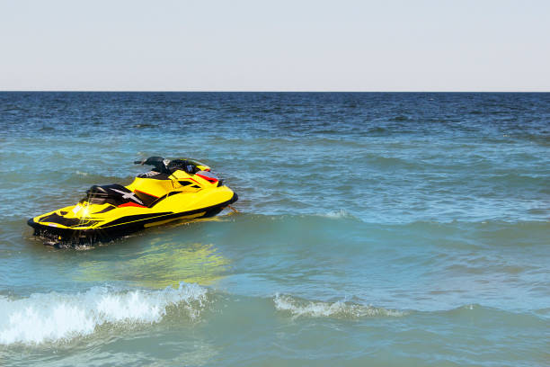 istock Yellow Jet ski on the beach 821752498