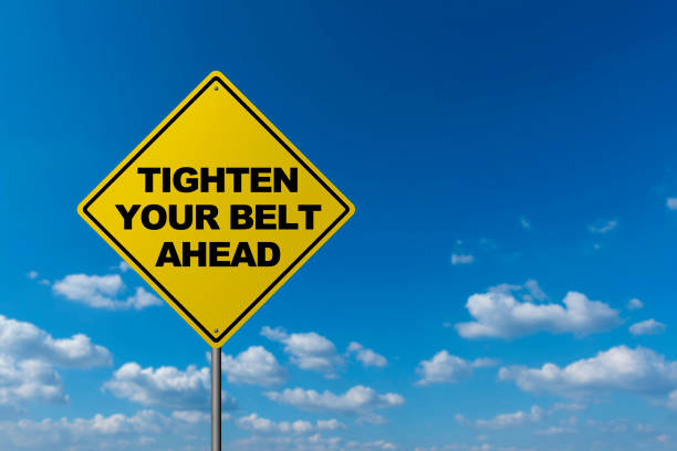 istock TIGHTEN YOUR BELT AHEAD - Road Warning Sign 821756454