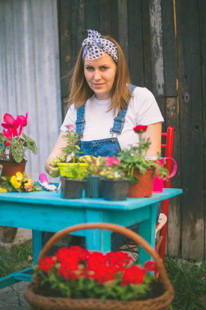 istock Young woman gardening 821759898
