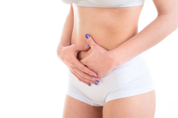 istock woman having stomach ache, White isolated background 821761676