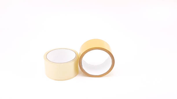 istock Thick transparent plastic tape and brown plastic tape in white big core 821766638