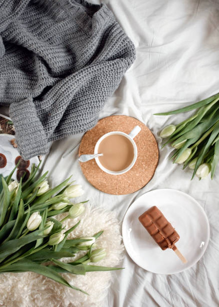istock A cup of coffee and a cake  on a cozy tablecloth 821768360