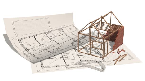 istock House project - house under construction on blueprint - project for construction industry 821768444