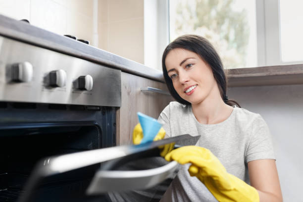 istock woman cleaning kitchen 821769102