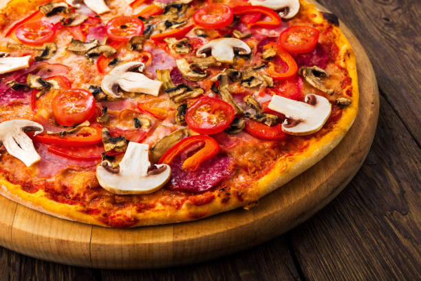 istock Delicious pizza with mushrooms and pepperoni 821782962