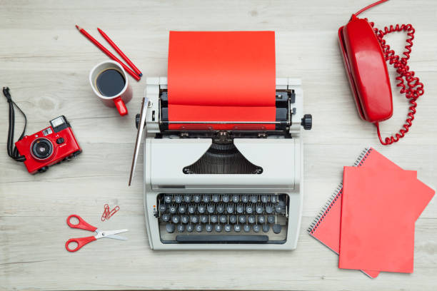 istock White and red typewriter and office supplies 821783536