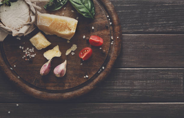 istock Cheese delikatessen closeup on rustic wood, brie and parmesan 821789888