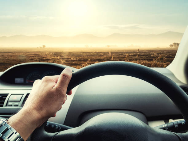 istock man driving car on the road 821791066